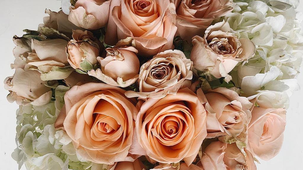 Soft Peachy/Pink Rose & Hydrangea · Such a warm and soft arrangement with the softest, pale pink and peach spray roses with creamy white hydrangeas.
