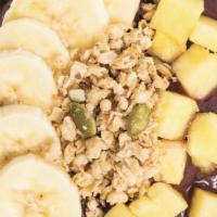 Tropical Acai Bowl · Base blend: acai, cream of coconut, blueberries, banana. Topped with: granola, banana and pi...