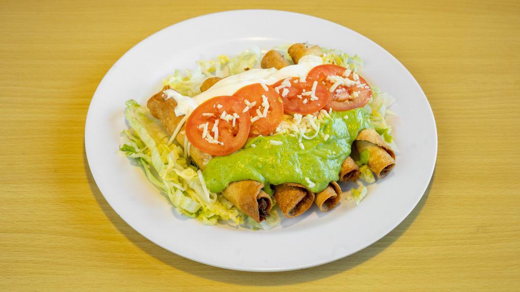 Five Rolled Tacos Special · Lettuce, cotija cheese, tomatoes, guacamole, sour cream.