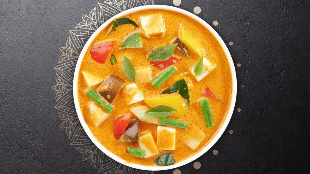 Yellow Curry · Yellow curry with coconut milk, potatos, onions, carrots, broccoli, bell peppers, spices, and herbs. Served with steamed jasmine rice.