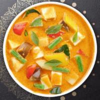 Massaman Curry  · Potatos, onions, carrots, tomatoes, and peanuts in massaman curry sauce. Served with steamed...