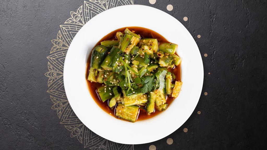Cucumber Salad  · Sliced cucumbers in a soy mustard vinaugrette topped with sesame seeds.