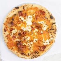 Pierogi Pizza · Fresh mashed potatoes, bacon, caramelized onion, house made farmers cheese and cheddar. A tr...