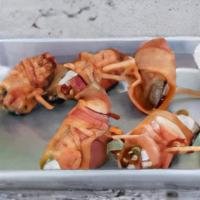 Bacon Wrapped Jalapeno Poppers · Six  Jalapeno Peppers filled with cream cheese wrapped with Bacon.