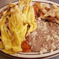 #15 Chilaquiles Y Huevo / Chilaquiles & Eggs · Tiras de tortilla de maíz fritas, cebollas salteadas, con chile rojo o verde y queso, papas ...