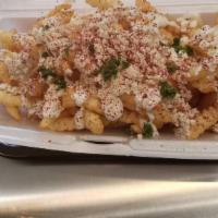 Greek Fries · Our fries with garlic sauce and feta cheese.