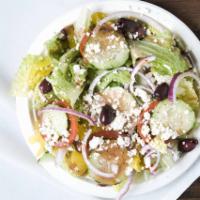 Greek Salad · Romaine lettuce, tomatoes, cucumber, red onions, pepperoncini, kalamata olives, with our fam...