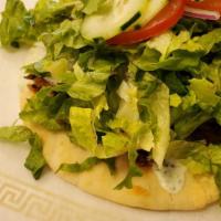 Mix Veggie Pita · Falafel,cauliflower,eggplant, on a pita with Hummas, tahini sauce, and fresh veggies.