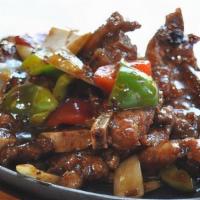 Beef Short Ribs With Black Pepper · Seasoned beef short ribs stir-fried with bell peppers and onions.