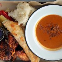 Hat Yai Combo · Three pieces, leg, thigh and wing, of our Hat Yai Fried Chicken (GF) served with one roti (a...