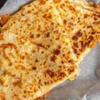 Quesadilla · Handmade flour tortilla, Monterey Jack cheese, and our signature chicken.