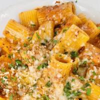 Rigatoni Alla Bolognese · Beef and pork bolognese, san marzano sugo.