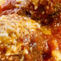 Polpette Con Polenta · Spicy housemade meatballs, soft gorgonzola polenta, marinara