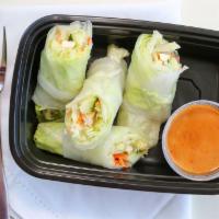 Fresh Summer Rolls · Tofu, lettuce, carrots, cucumbers and green leaves wrapped with rice paper and served with h...