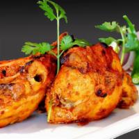 Classic Tandoori Chicken Rice Bowl · Exquisite tandoor chicken grilled and marinated to perfection with customer's choice of sauc...