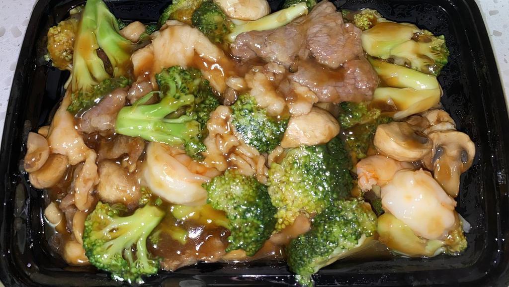 Triple Delight · A splendid combination of jumbo shrimp, chicken and beef with variety of vegetables in delicate brown sauce.