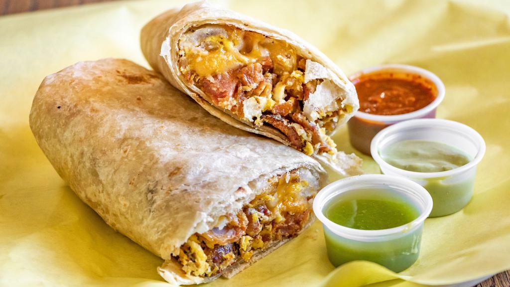 Super Bacon Burrito · Bacon, Bell Peppers, Onions, Eggs and Cheese.