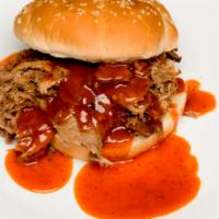 Pulled Pork Sandwich · Pork shoulder, slow smoked and hand pulled.