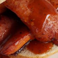 Spicy Hot Links Sandwich · Grilled spicy links served on bun and sauced.
