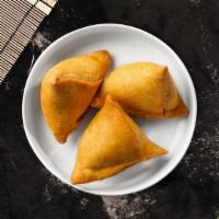 Soulful Samosa · Fried pastry shells, cumin potatoes served with chickpeas cholay & chutneys.