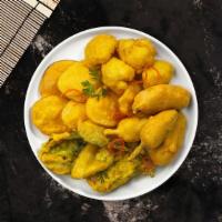 Pak Pak Pakora · Dipped in a spicy batter and fried to perfection
