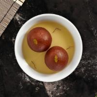 Gulab Jamun · Spongy milky balls soaked in syrup.