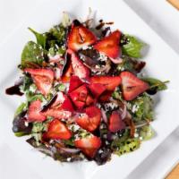 Feta Berry · Spring greens, fresh berries, caramelized walnuts, feta and strawberry vinaigrette.