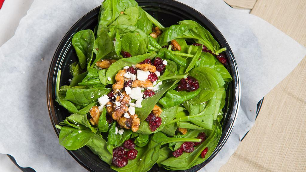 Small Sweet Leaf Salad · Spinach, Dried Cranberries, Canied Walnuts and Feta Crumbles with Balsamic Vinaigrette on the side.