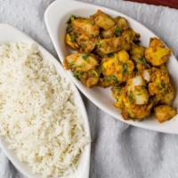 Aloo Gobi · Vegan. Fresh cauliflower and potatoes cooked with onion, herbs and spices.