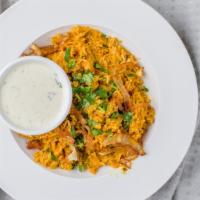 Chicken Biryani · Basmati rice cooked with chicken marinated in special sauce, with herbs & spices.