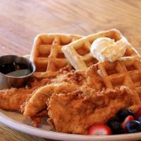 Chicken & Waffles · Three of our famous hand-battered chicken tenderloins on top of Belgian waffles. Served with...