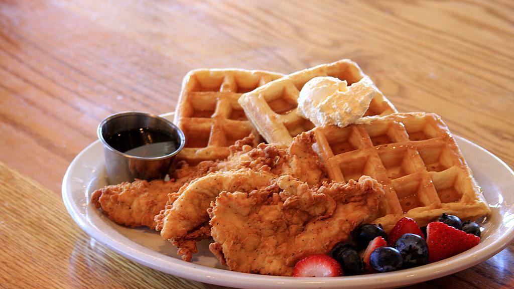Chicken & Waffles · Three of our famous hand-battered chicken tenderloins on top of Belgian waffles. Served with whipped margarine and hot maple syrup.