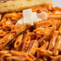 Penne & Grilled Chicken À La Vodka · Penne pasta simmered in a creamy vodka sauce topped with our tender grilled chicken breast, ...