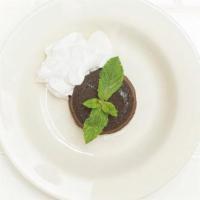 Chocolate Tartufo · Warm triple chocolate cake with a chocolate truffle center, whipped cream, and vanilla gelato.