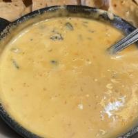 Original Con Queso Or Spinach Dip · Your choice of Original Chile Con Queso Dip or Spinch Con Queso Dip served with flour tortil...