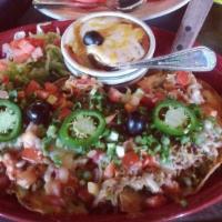 Nachos Supremos · Choice of machaca beef, chicken or ground beef. Served with our spicy bean dip on the side. ...