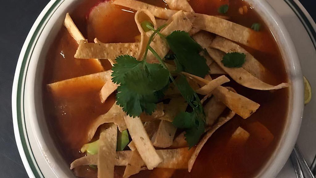 Shrimp Tortilla Soup · In a spicy tomato broth with fried corn tortilla strips, monterey jack cheese, radishes and avocado slices on top. Warm flour tortilla too!