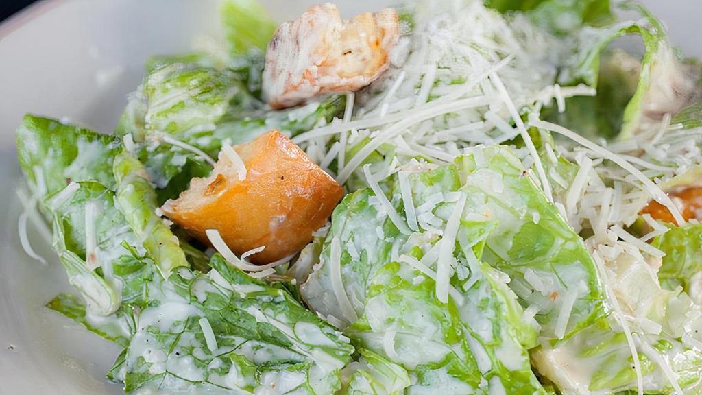 Caesar Salad · hearts of romaine, Parmigiano-Reggiano, garlic-herb croutons