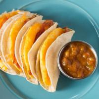 Breakfast Tacos · Four corn tortillas with egg, cheese, and choice of bacon, sausage, ham, pastrami or avocado...