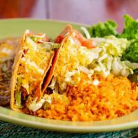 Crunchy Tacos · Two taco shells filled with ground beef or chicken, topped with lettuce, tomatoes, and chees...