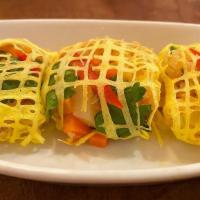 La Tiang · Minced shrimp, carrots, and potatoes with a mesh omelet wrapping. (3) (GF)