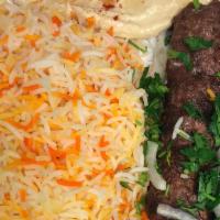 Lamb Kebab With Rice · Ground lamb grilled a skewer with traditional rice.