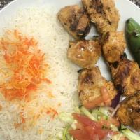 Chicken Kebab With Rice · Marinated chicken cubes grilled on a skewer with traditional rice.