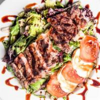 Chef’S Special Steak Salad · Tender steak steak sliced on a bed of fresh garden salad, tossed in an Italian vinaigrette, ...