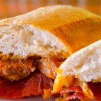 Chicken Parmesan Sandwich · Golden fried chicken topped with marinara and mozzarella on a toasted hoagie roll.