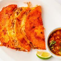 Quesabirrias · 3 corn tortillas dripped in consomme, filled with monterey cheese and birria. Served with li...