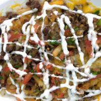 Carne Asada Fries · Fries topped with carne asada, pico de gallo, sour cream, and cheese.