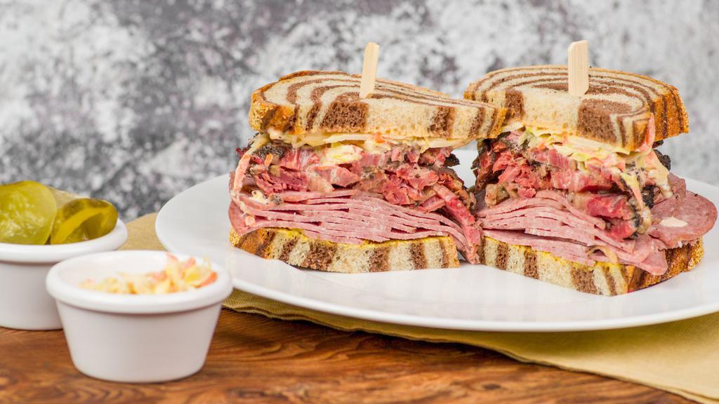Miss Maisel · Madge's deli favorite! Our famous pastrami sliced and glatt kosher beef salami at least 12 oz of meat served with mustard, Russian, and coleslaw. Pickles and coleslaw side. Sub potato salad for an additional charge. Rye, marble rye, gluten free, or sub a bagel for an additional charge.