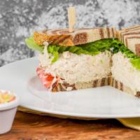 Tuna Salad · Albacore tuna salad sandwich served with lettuce and heirloom tomato. Pickles and coleslaw s...