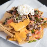 Nachos Or Fries · Cheese, pico, jalapenos, beans and sour cream with optional choice of meat.